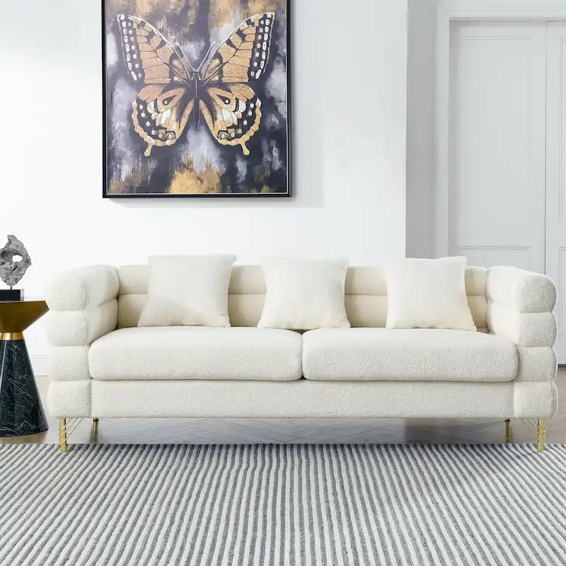 Canapé Art Déco 3 places en tissu Teddy, 3 coussins lombaires et pieds en métal doré — 205 cm